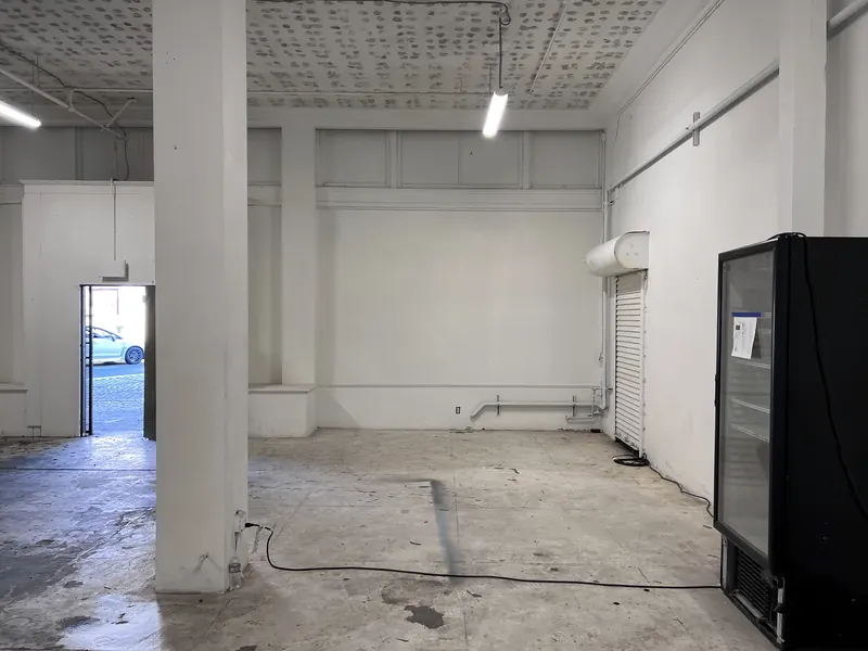A unit corner with a roll-up door and a street door